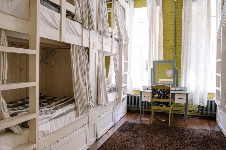 Comfortable hostel dorm room with clean bunk beds and a cozy ambiance.